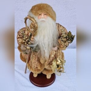 Luxurious Gold and Cream Santa Claus Figurine On Wooden Stand